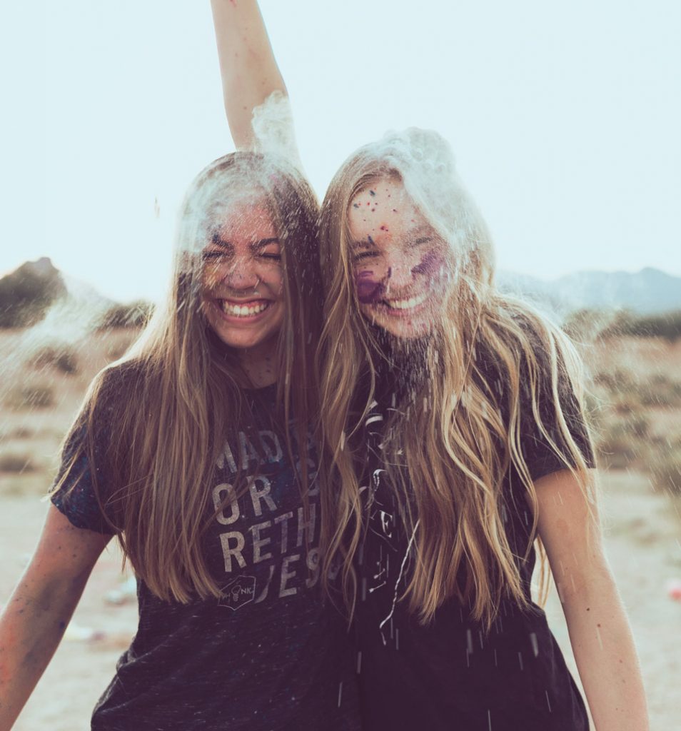 Two happy girls with confetti